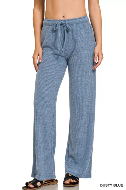 Woman wearing dusty blue ribbed knit wide-leg lounge pants with drawstring waist