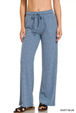 Woman wearing dusty blue ribbed knit wide-leg lounge pants with drawstring waist