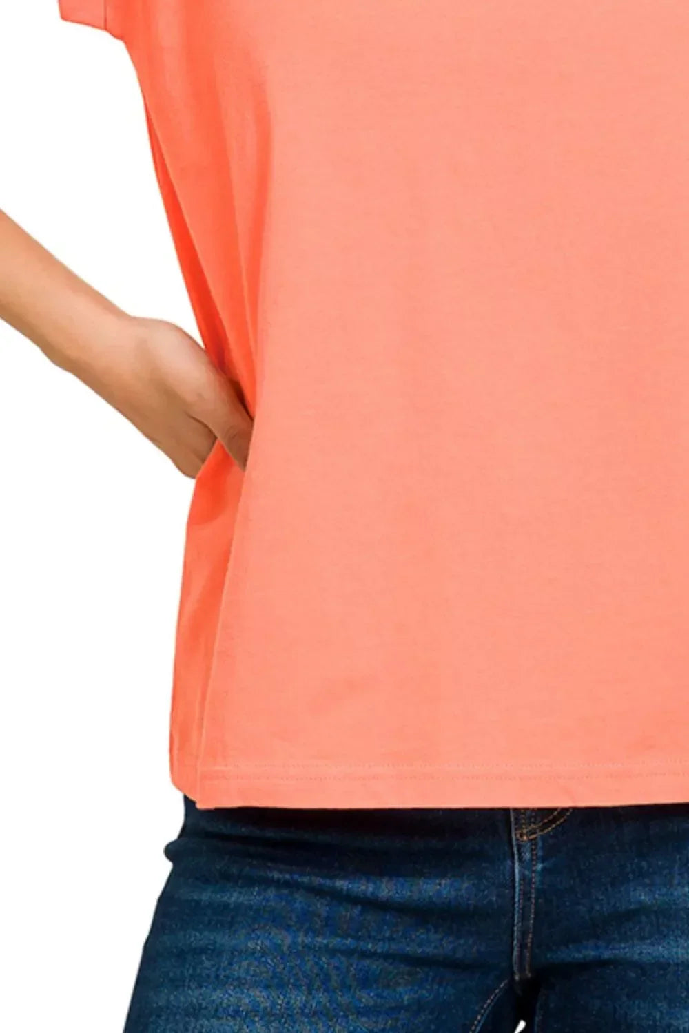 Coral short sleeve relaxed fit top paired with dark blue denim jeans