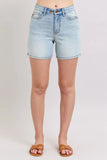 Light wash denim shorts with front pockets, high waist and casual fit, modeled on a woman