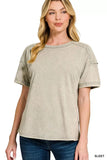 Woman wearing a relaxed fit, short sleeve washed beige t-shirt with subtle seam detailing