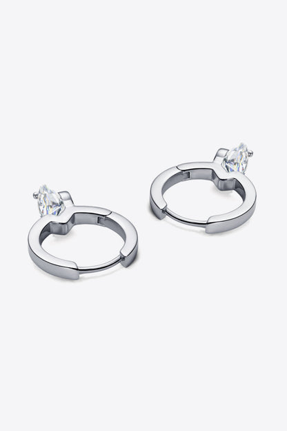 Pair of silver hoop earrings with marquise-cut clear gemstones on a white background