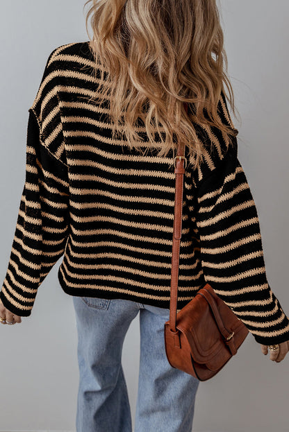 Woman wearing a black and beige striped sweater, light blue jeans, and brown crossbody bag