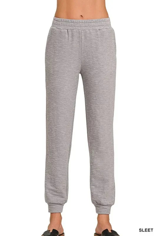 Woman wearing light Grey Zenana Cotton Slub Jogger Pants with elastic waistband and cuffed ankles