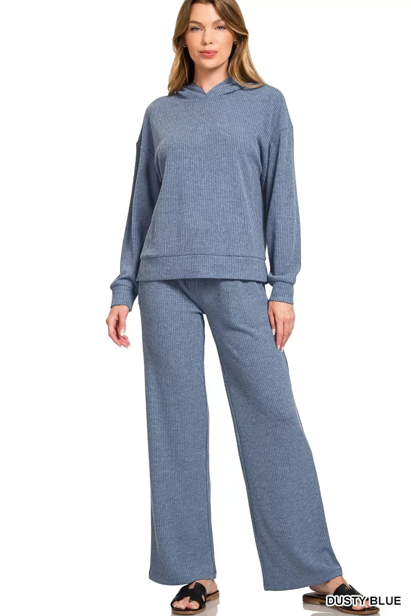 Woman wearing relaxed fit dusty blue ribbed knit hoodie and wide-leg pants set