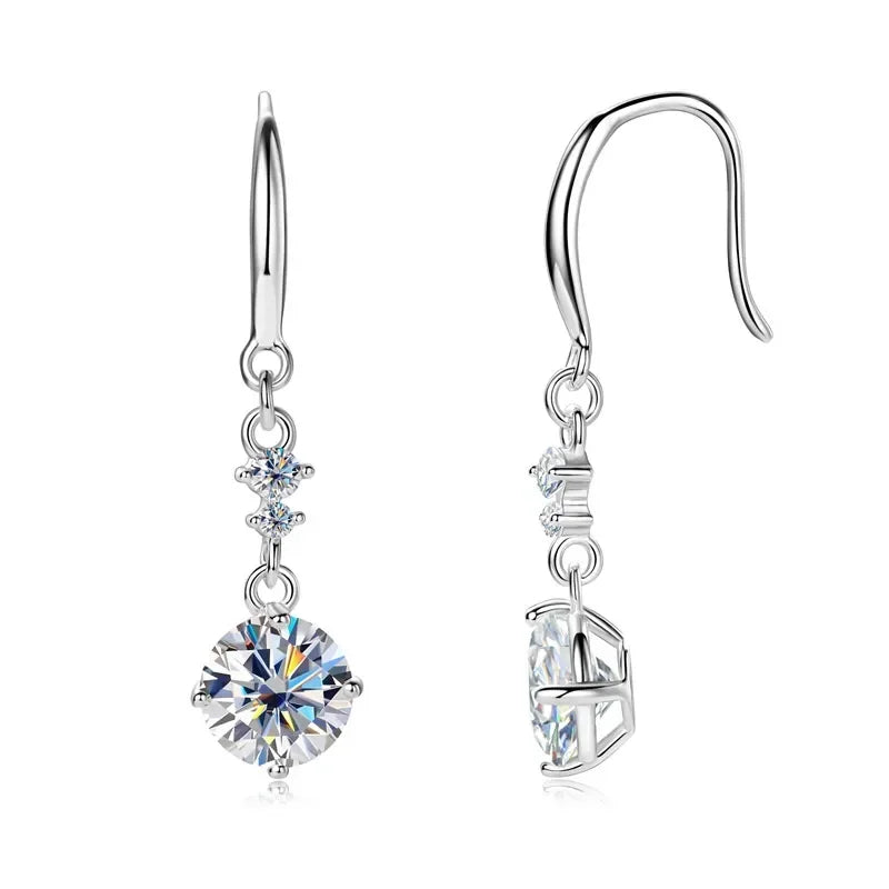 Silver drop earrings with sparkling round and small cubic zirconia stones on white background