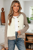 Woman wearing a colorblock knit cardigan with taupe sleeves and cream front, styled with jeans.