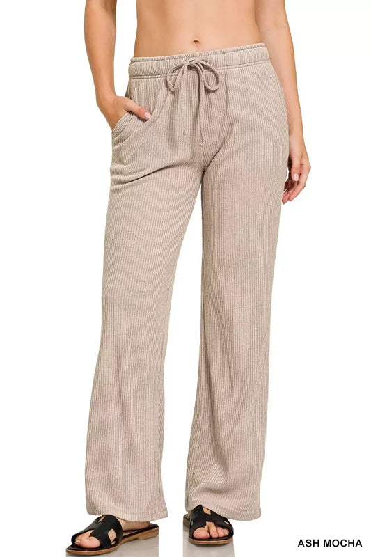 Woman wearing ribbed ash mocha lounge pants with drawstring waist and side pockets