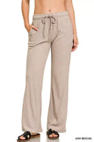 Woman wearing ribbed ash mocha lounge pants with drawstring waist and side pockets
