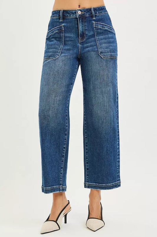 Wide leg cropped blue jeans with front patch pockets, styled with two-tone heels