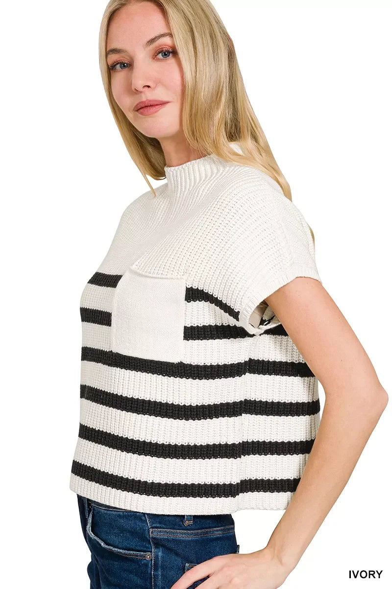 Woman wearing ivory knit short-sleeve sweater with black stripes and chest pocket