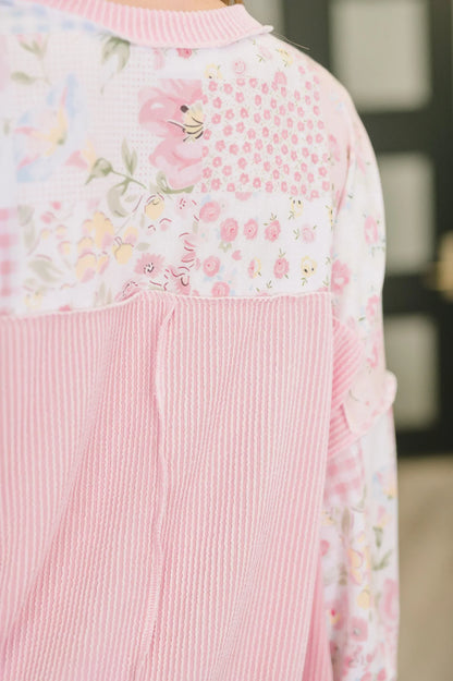 Back view of a women’s top with pink striped and floral patchwork fabric details