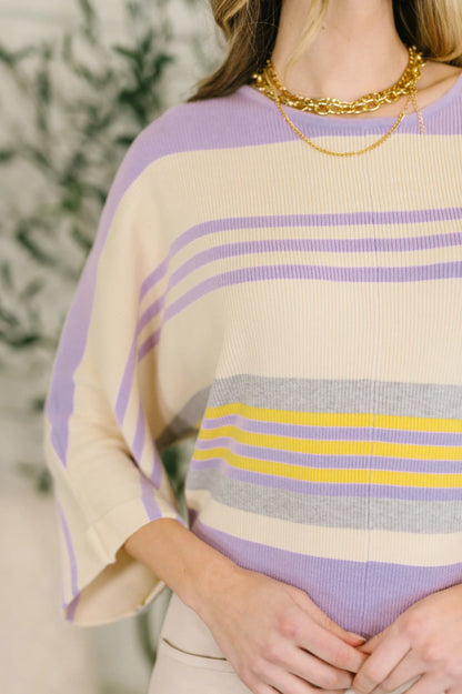 Striped dolman sleeve top with pastel lavender, yellow, and cream color blocking.