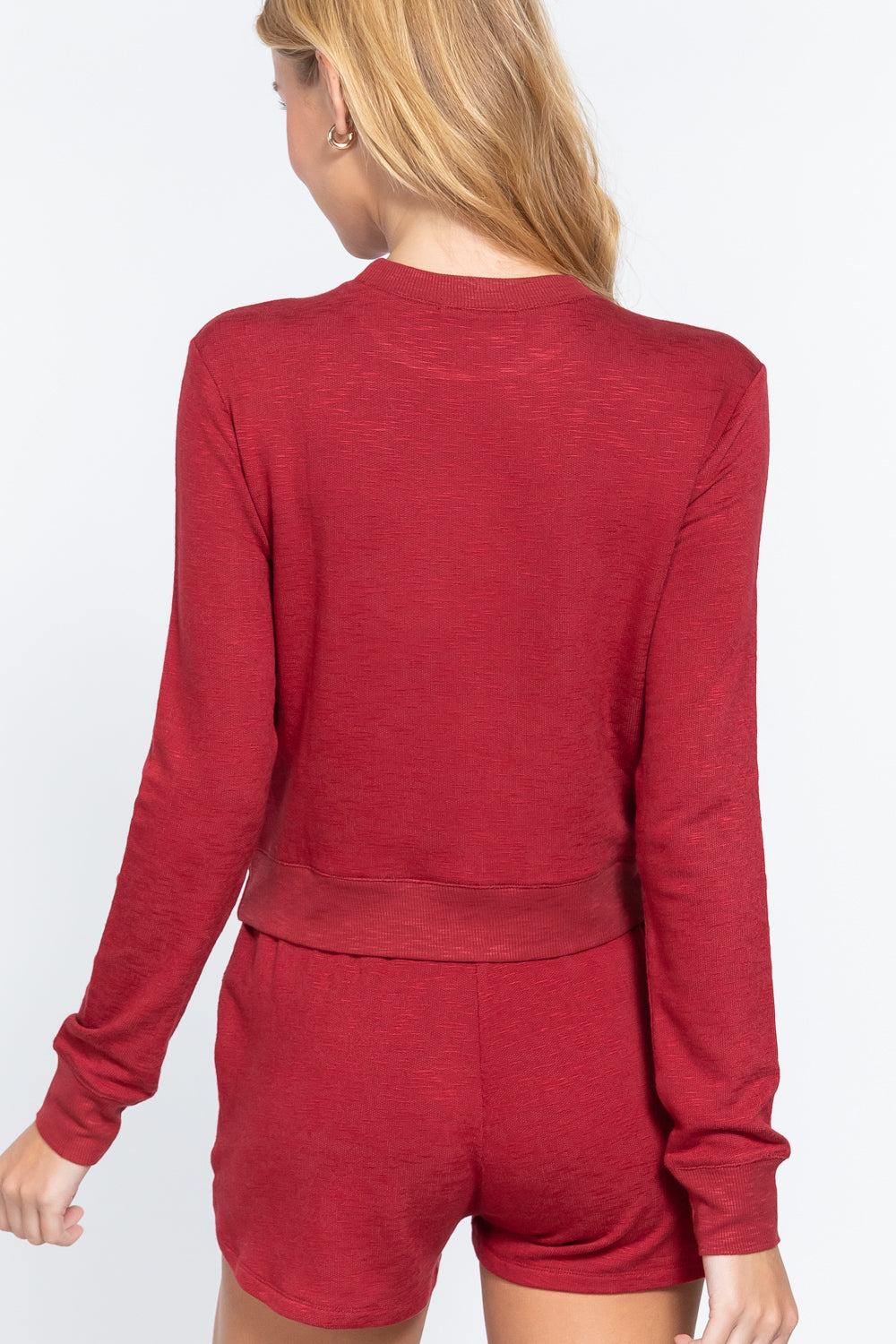 the back of a Woman wearing a red Long Sleeve Crew Neck Slub Terry Top with matching shorts on a white background
