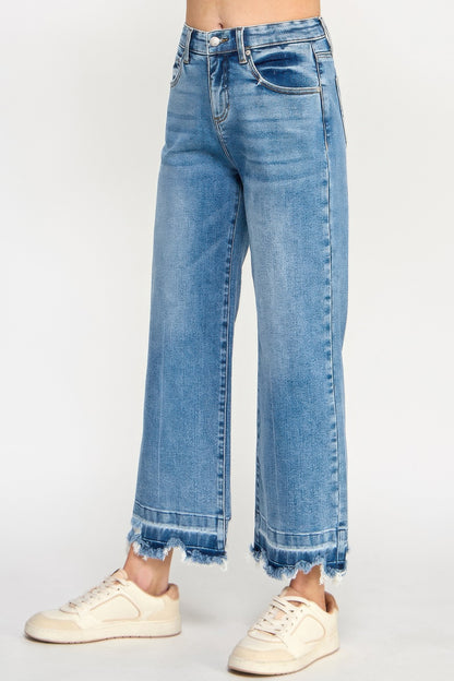 Tummy Control Cropped Wide Leg Jeans with a frayed hem worn by a woman on a white background