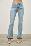 Light wash high-rise straight leg jeans with raw hem, paired with nude heels