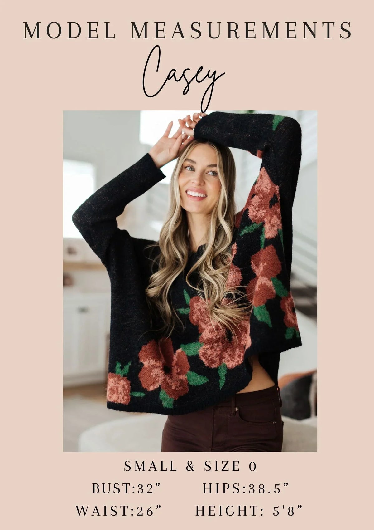 Woman modeling black floral oversized sweater, casual indoor setting, model measurements listed.