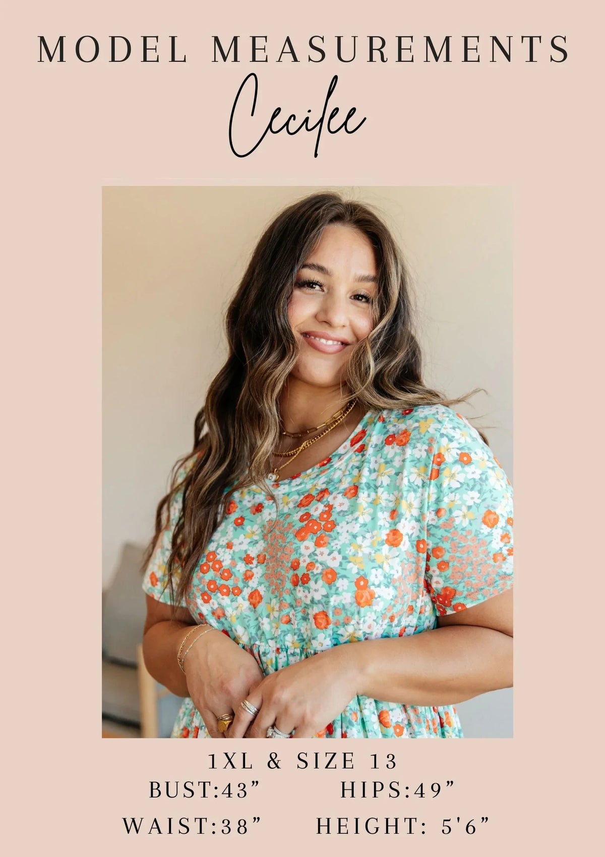 Smiling woman in a floral dress with measurements, showcasing plus size fashion model.