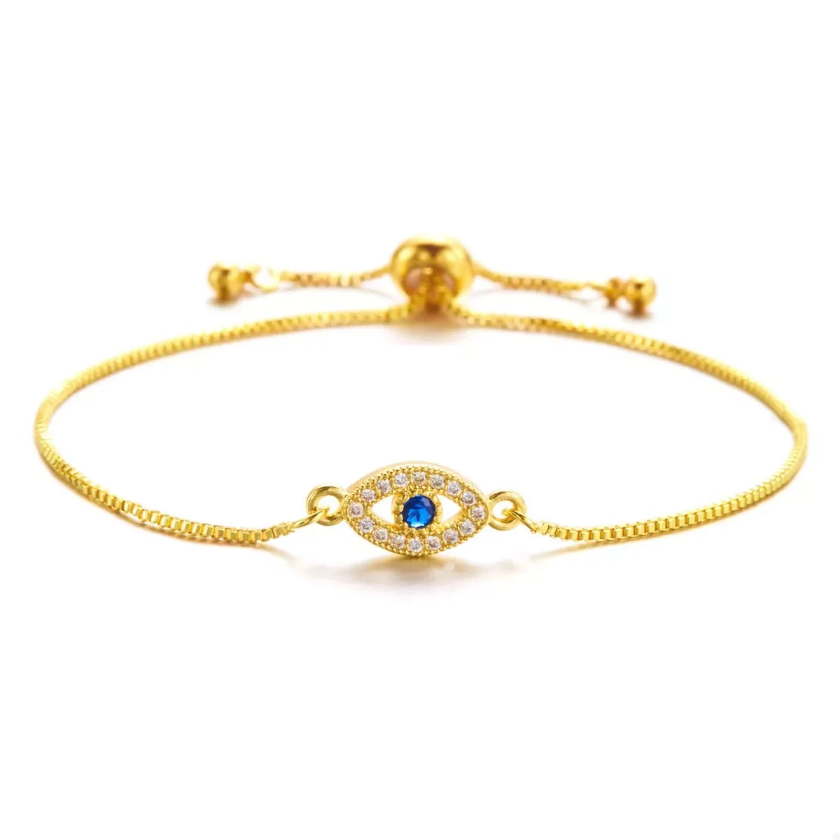 Gold adjustable bracelet with blue and white evil eye charm on white background