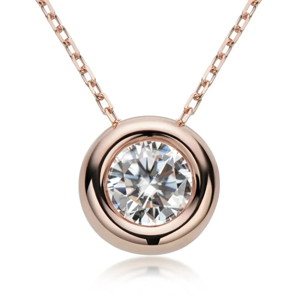 Rose gold pendant necklace with round bezel-set clear gemstone on fine chain