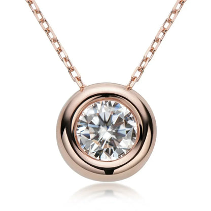 Rose gold pendant necklace with round bezel-set clear gemstone on fine chain