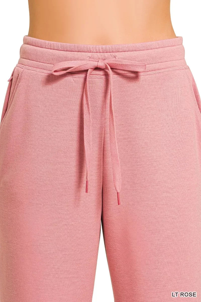 Light rose pink women’s jogger pants with drawstring waist and side pockets