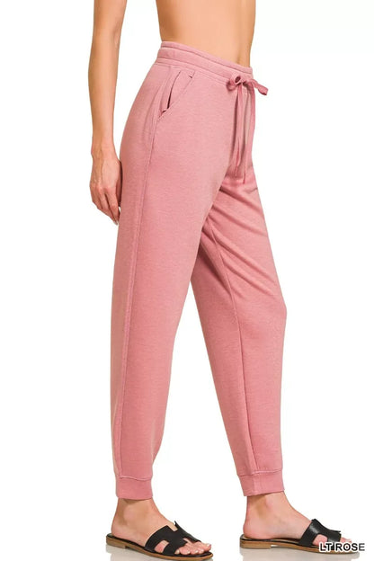 Women's light rose relaxed jogger pants with drawstring waist and side pockets