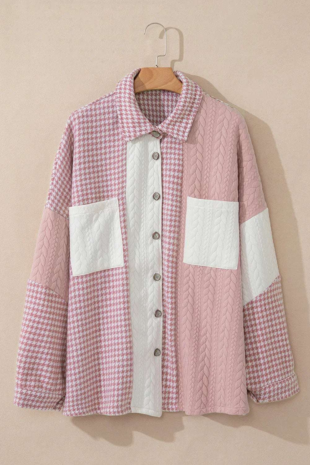 Pink and white patchwork button-up shirt with textured knit patterns and two front pockets