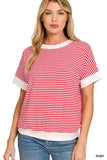Woman wearing a red and white striped short sleeve top with relaxed fit and white trim.