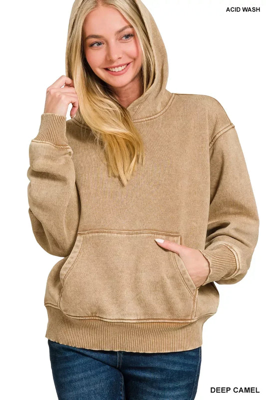 Woman wearing an acid wash deep camel hoodie with kangaroo pocket and relaxed fit