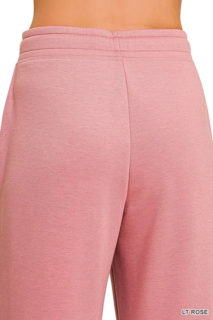 Close-up of light rose pink relaxed fit women's lounge pants waistband and fabric