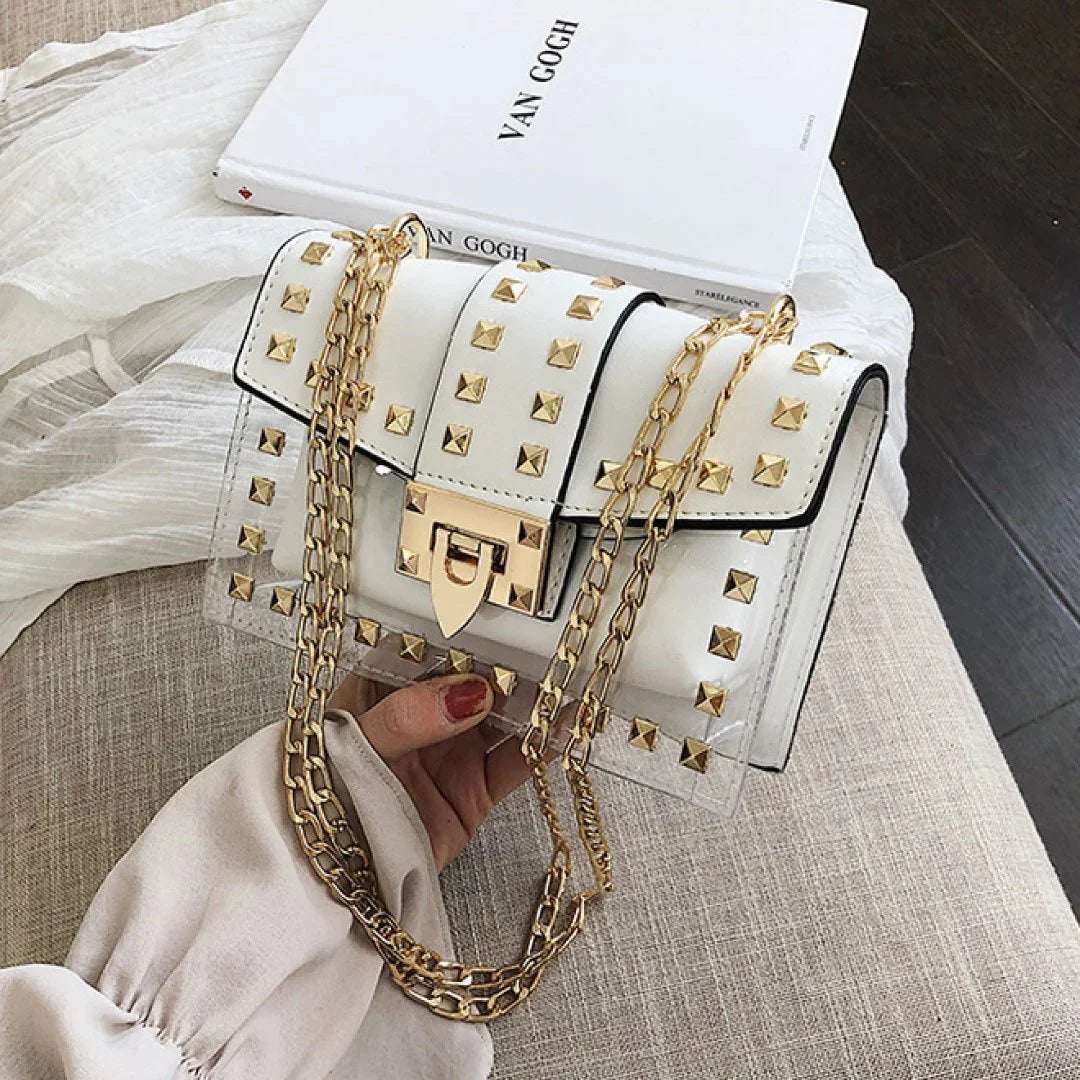 Clear and white shoulder bag with gold chain strap and gold stud accents