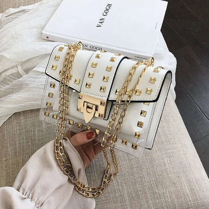 Clear and white shoulder bag with gold chain strap and gold stud accents
