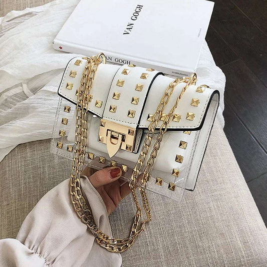 Clear and white shoulder bag with gold chain strap and gold stud accents