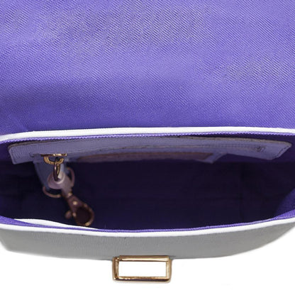 Interior view of a small white leather handbag with purple lining, gold clasp, and inner pocket.