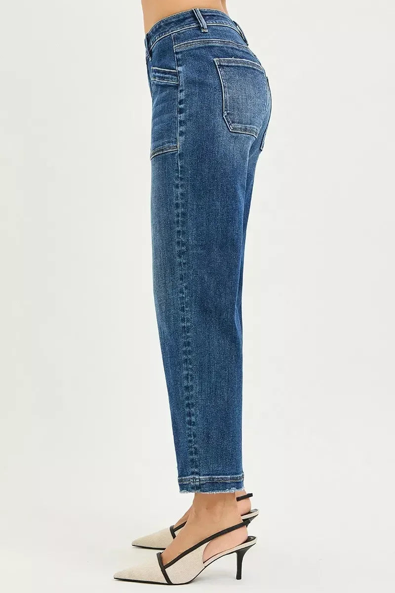 Side view of woman wearing high-waisted blue straight-leg jeans and heels