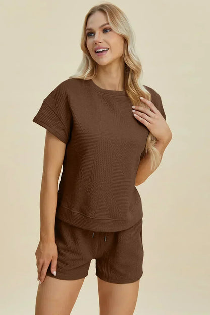 Woman wearing brown textured short sleeve lounge set with relaxed fit shorts
