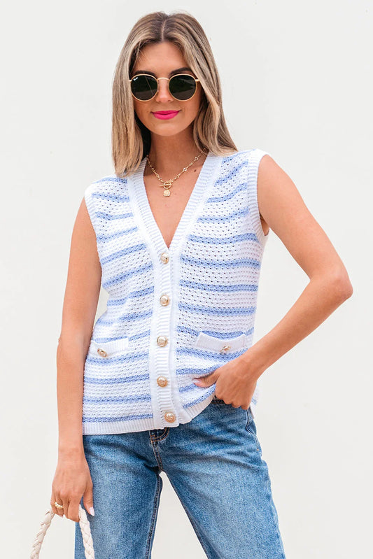 Woman wearing a sleeveless knit button-up vest with blue and white stripes, paired with jeans.