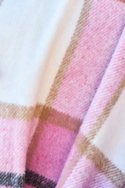 Soft pink and cream plaid wool fabric with beige stripes, close-up texture