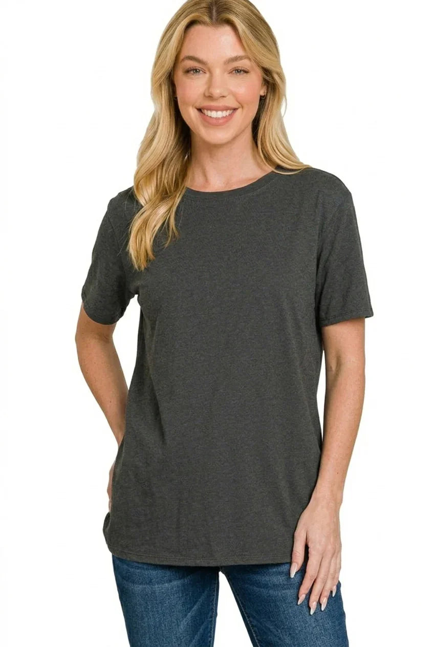 Woman wearing a charcoal grey short sleeve t-shirt with relaxed fit and blue jeans