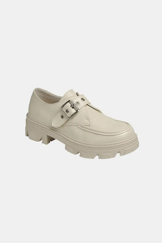 Chunky sole beige loafer with silver buckle detail, modern women's footwear on white background
