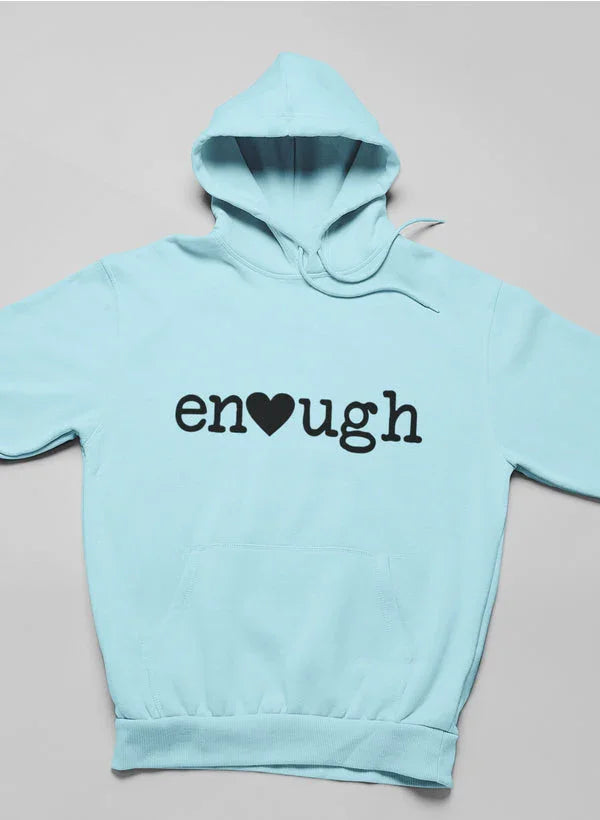 Light blue women's hoodie with 'enough' and heart graphic on front, laid flat.