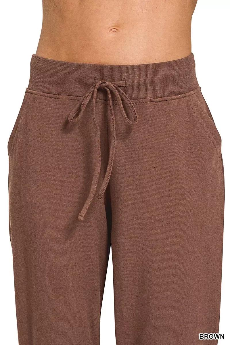 Brown drawstring high-waisted sweatpants with side pockets, relaxed fit