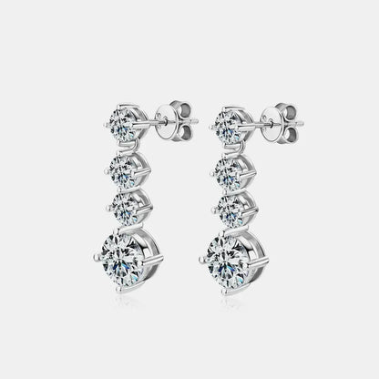 Elegant silver drop earrings with five round-cut clear stones on a white background