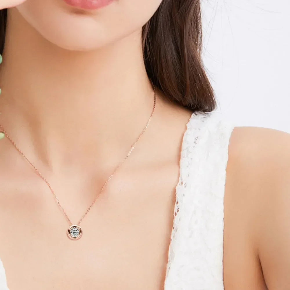 Woman wearing a delicate gold pendant necklace and white textured sleeveless top