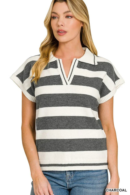 Woman wearing a charcoal and white striped short sleeve knit polo top with V-neck.