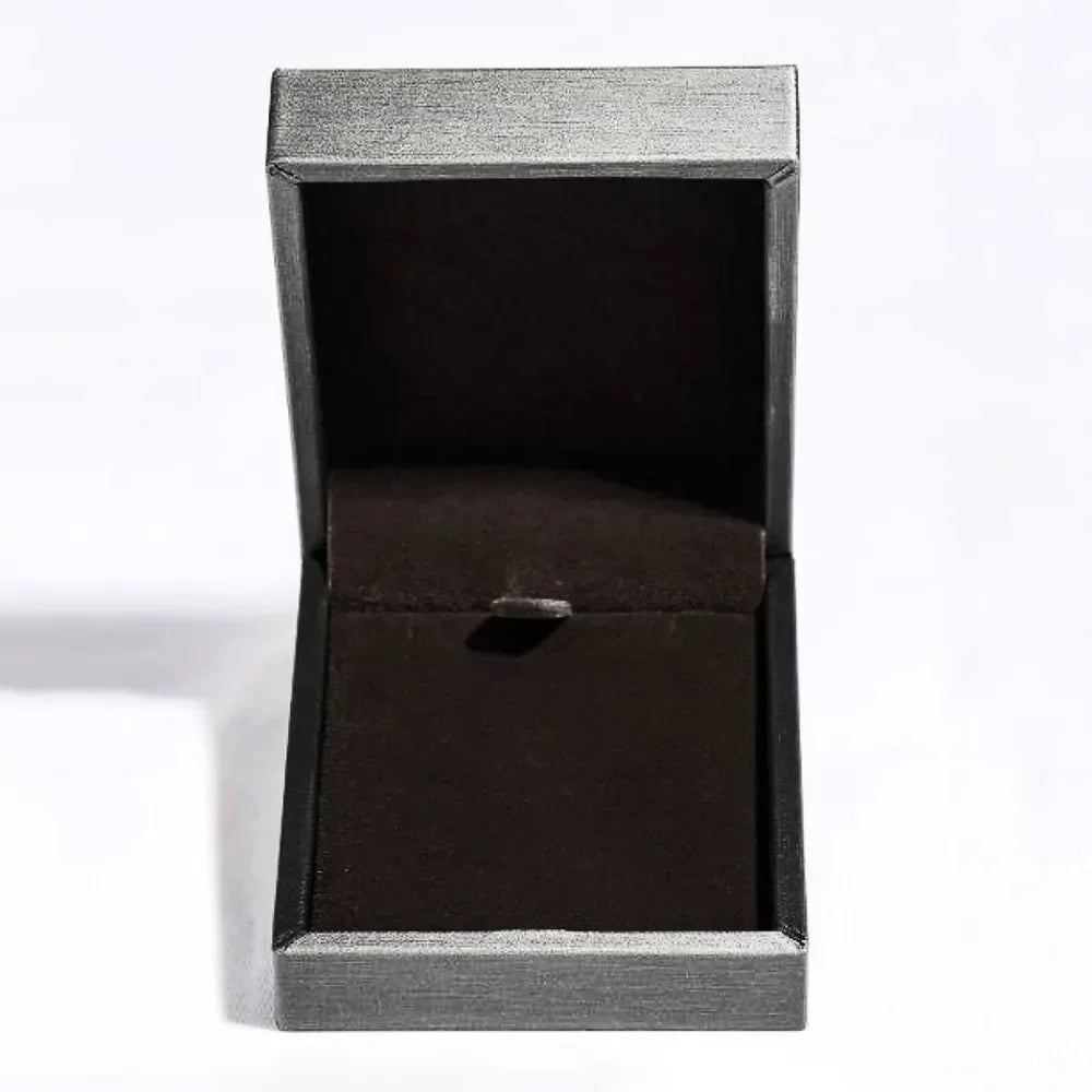 Empty black jewelry box with soft velvet interior on a white background