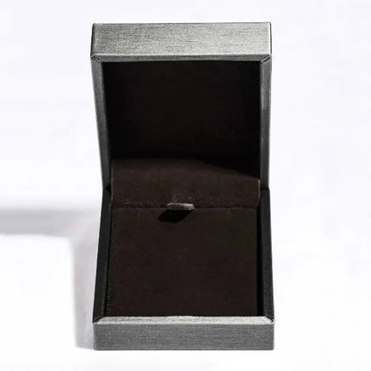 Empty black jewelry box with soft velvet interior on a white background